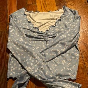 light blue shirt with flowers